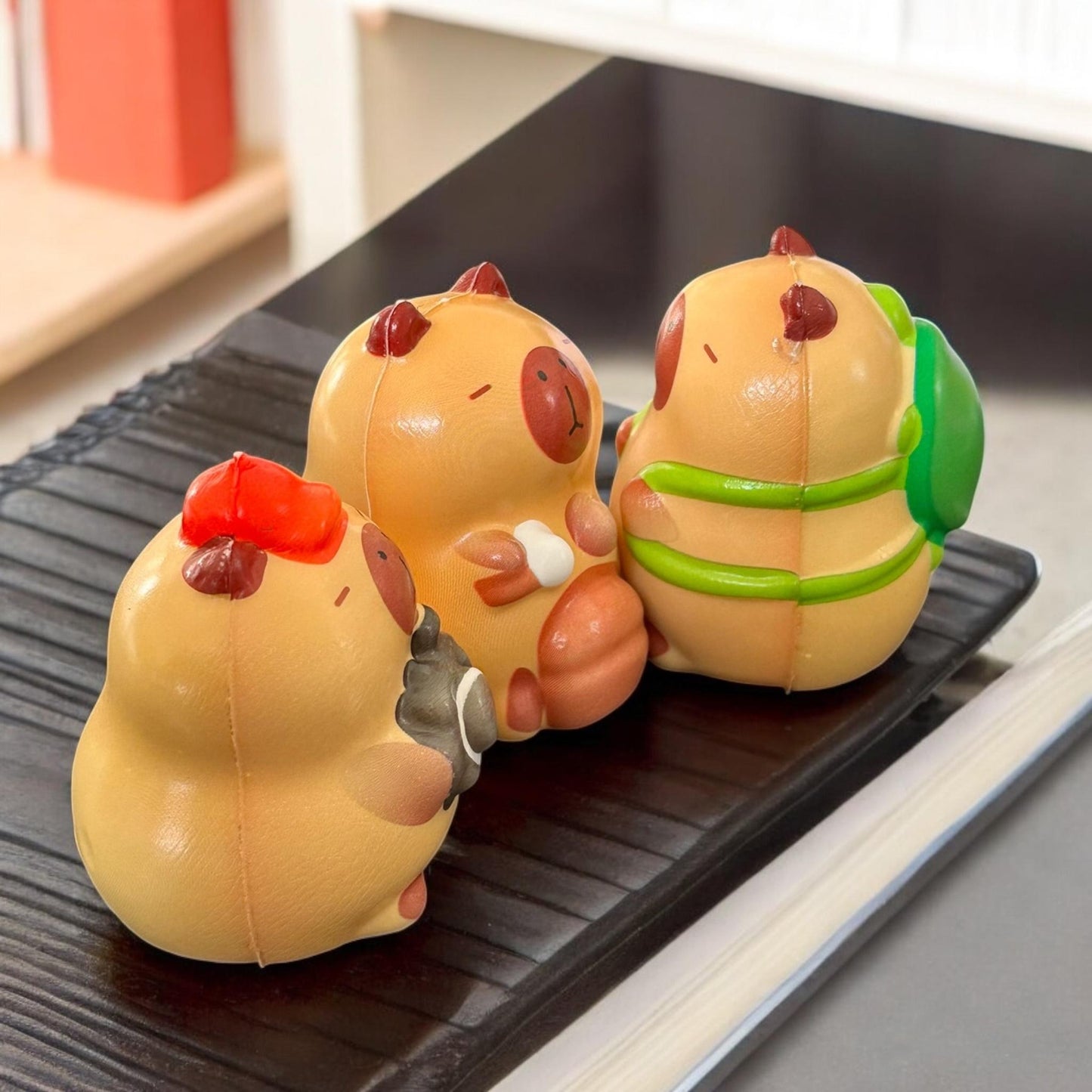 12 Squishies capibaras G $13.5 c/u
