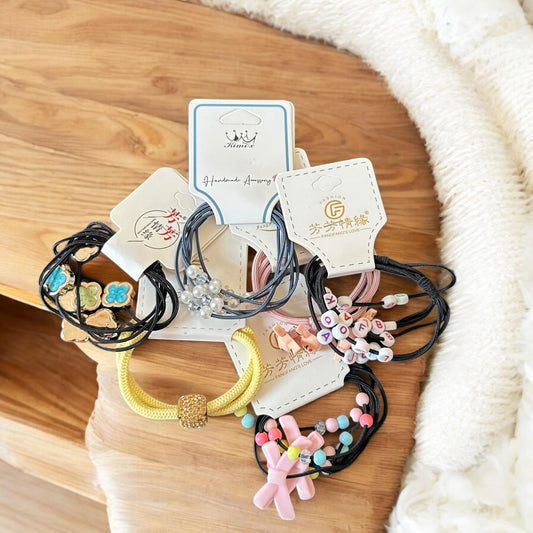 12 Sets de Ligas para Cabello Decoradas $5.9 c/u