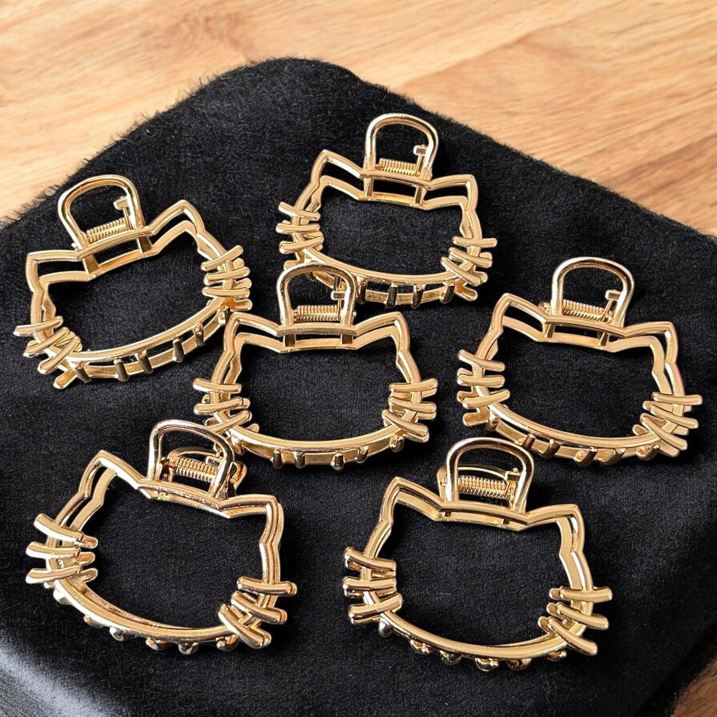 12 Pinzas Kitty Cabecita Doradas $12 c/u