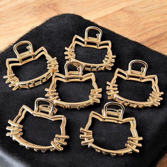 12 Pinzas Kitty Cabecita Doradas $12 c/u