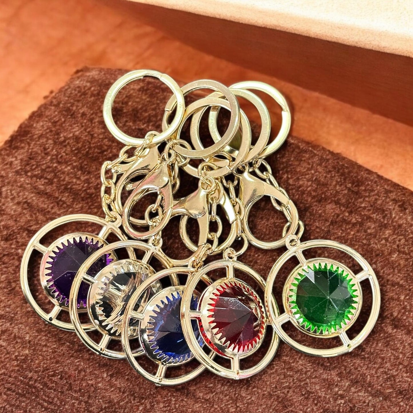 12 Llaveros Piedra Hermosa Dorados $5.9 c/u