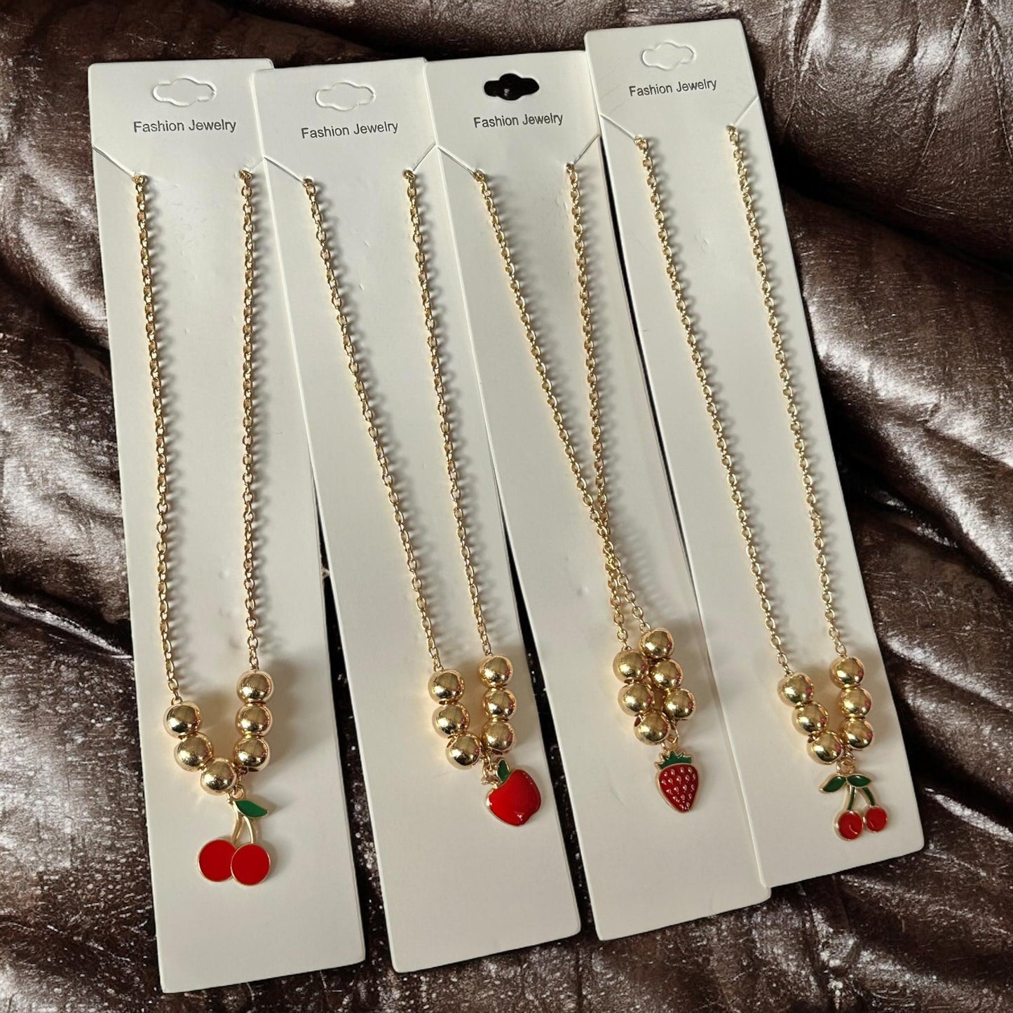 12 Collares Cerezas/Fresas Bolitas $8.3 c/u