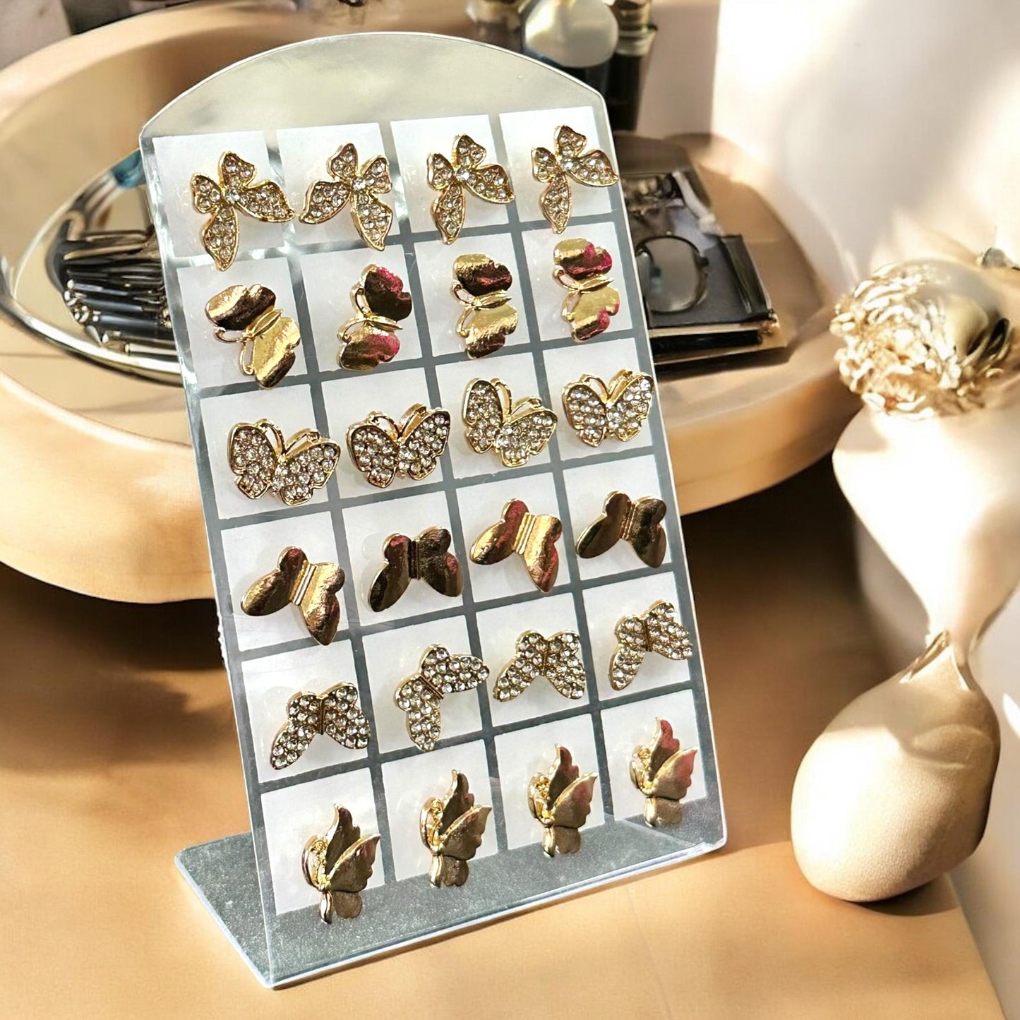 12 Aretes Dorados Moños/Mariposas $7.5 c/u