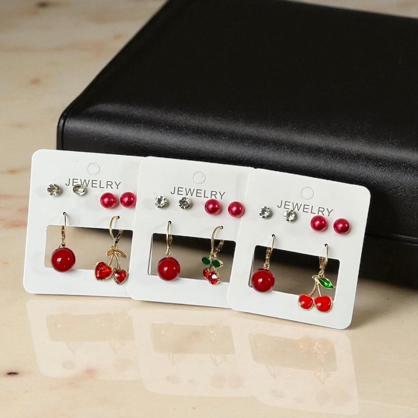 12 Sets de Aretes Cereza/ Pedreria $11.5 c/u