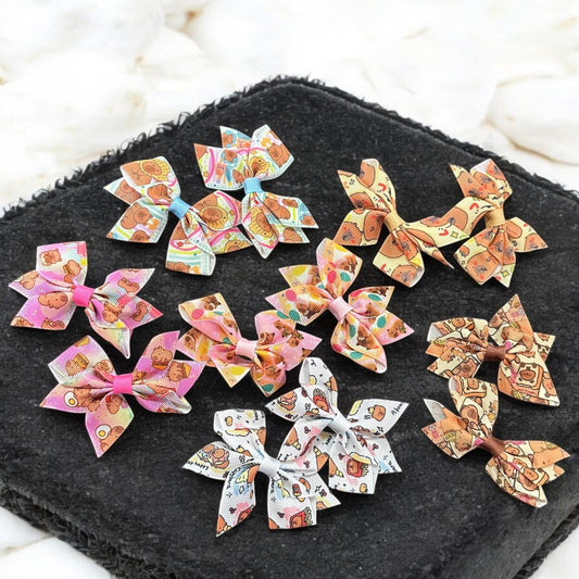 12 Pares de Moñitos Capibaras Decorados $7 c/u