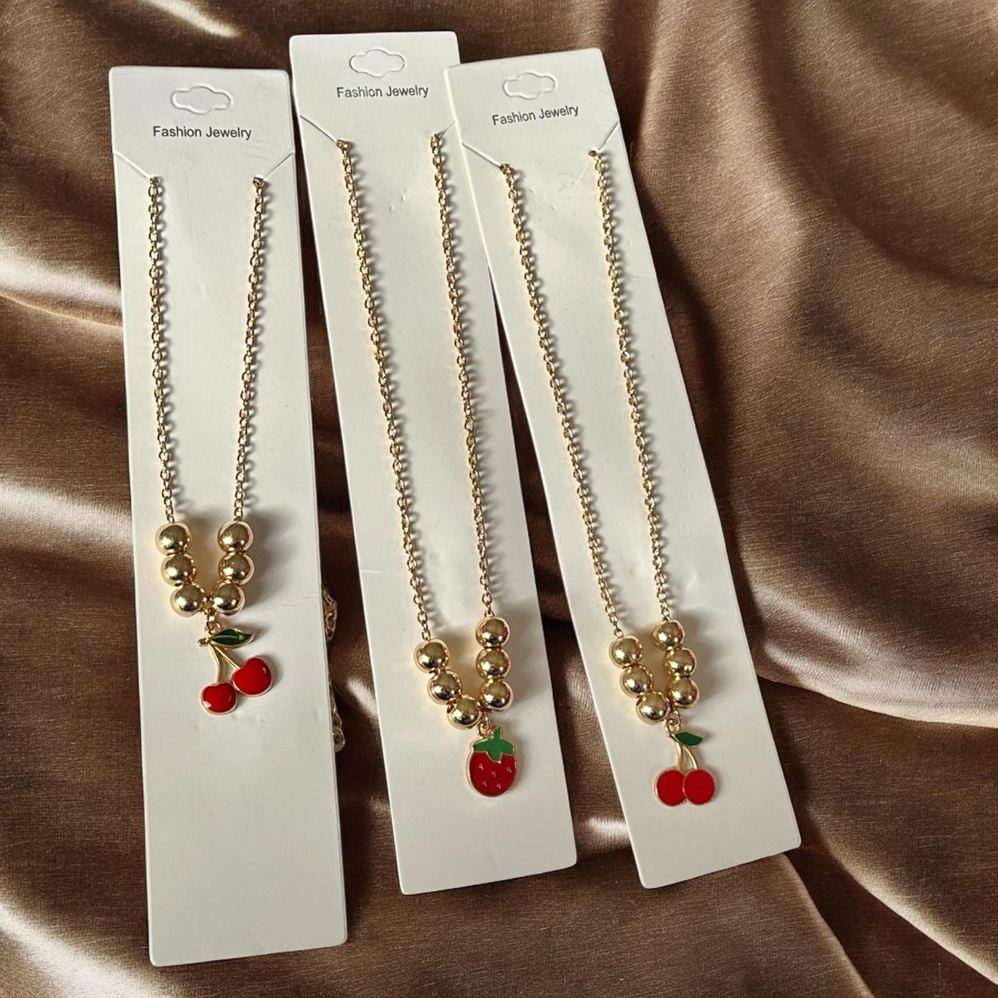 12 Collares Cerezas/Fresas Bolitas $8.3 c/u